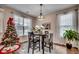 Bright dining room with a table and chairs, near a decorated Christmas tree at 5433 Merrywind Ct., Myrtle Beach, SC 29579
