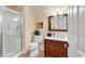 Bathroom with shower, toilet and wood vanity at 5603 Leatherleaf Dr., North Myrtle Beach, SC 29582