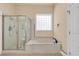 Bathroom with shower, bathtub, and window at 5603 Leatherleaf Dr., North Myrtle Beach, SC 29582