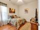 Cozy bedroom featuring a floral comforter and hardwood floors at 5603 Leatherleaf Dr., North Myrtle Beach, SC 29582