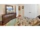 Bedroom with floral bedding and a large dresser with mirror at 5603 Leatherleaf Dr., North Myrtle Beach, SC 29582