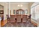 Formal dining room with large windows and chandelier at 5603 Leatherleaf Dr., North Myrtle Beach, SC 29582