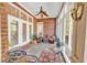 Relaxing sunroom with brick walls and wicker furniture at 5603 Leatherleaf Dr., North Myrtle Beach, SC 29582