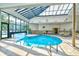 Indoor heated pool with skylights and seating area at 5905 South Kings Hwy. # 6113-D, Myrtle Beach, SC 29575