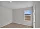 Bedroom with window, carpet, and door to hallway at 60 Cape Point Dr., Conway, SC 29527