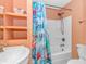 Bathroom with shower/tub combo, pedestal sink, and decorative shower curtain at 6001-1604 S Kings Hwy., Myrtle Beach, SC 29575
