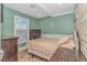 Cozy bedroom with a double bed and wood accents at 6001-1604 S Kings Hwy., Myrtle Beach, SC 29575