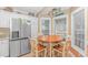 Bright kitchen nook with table and chairs, stainless steel appliances, and granite countertops at 6001-1604 S Kings Hwy., Myrtle Beach, SC 29575