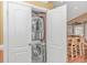 Convenient laundry closet with stacked washer and dryer at 6001-1604 S Kings Hwy., Myrtle Beach, SC 29575