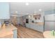 Open concept kitchen with light teal cabinets and wood flooring at 6001-Mh81 S Kings Hwy., Myrtle Beach, SC 29575