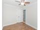 Empty bedroom with hardwood floors and door to bathroom at 704 Gumbo Limbo Ln., Myrtle Beach, SC 29579