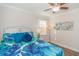 Bedroom with tropical bedding and wood floors at 704 Gumbo Limbo Ln., Myrtle Beach, SC 29579