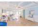 Living room with light blue walls, coffered ceiling, and comfortable seating at 704 Gumbo Limbo Ln., Myrtle Beach, SC 29579