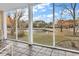 Relaxing screened porch overlooking a pond and lush greenery at 800 Sunswept Ct. # 102, Murrells Inlet, SC 29576