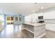 Kitchen with white cabinets, granite counters, and a large island at 8044 Fort Hill Way, Myrtle Beach, SC 29579