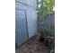 Small backyard patio with potted plants and access door at 830 N 44Th Ave. N # O-2, Myrtle Beach, SC 29577