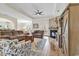 Bright living room with hardwood floors and a stone fireplace at 831 Wintercreeper Dr., Longs, SC 29568