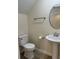 Clean bathroom with pedestal sink, toilet and towel rack at 908 Merriman Rd., Georgetown, SC 29440