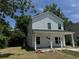Two-story house with white siding, front porch, and landscaped lawn at 908 Merriman Rd., Georgetown, SC 29440
