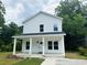 Two-story white house with a front porch at 908 Merriman Rd., Georgetown, SC 29440