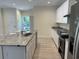 Modern kitchen with white cabinets, granite countertops and island at 908 Merriman Rd., Georgetown, SC 29440