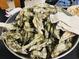 Pile of fresh oysters in a metal bowl at 908 Merriman Rd., Georgetown, SC 29440