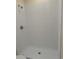 Clean shower with white wave patterned tile and a white shower pan at 908 Merriman Rd., Georgetown, SC 29440