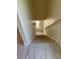 Clean, modern staircase with light wood steps and grey laminate flooring at 908 Merriman Rd., Georgetown, SC 29440