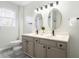 Updated bathroom with double vanity and oval mirrors at 917 9Th Ave. S, North Myrtle Beach, SC 29582