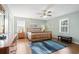 Bright bedroom featuring a wooden bed frame and ample natural light at 917 9Th Ave. S, North Myrtle Beach, SC 29582