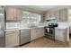 Kitchen with stainless steel appliances and light gray cabinets at 917 9Th Ave. S, North Myrtle Beach, SC 29582