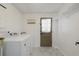Bright laundry room with washer, dryer, and extra shelving at 917 9Th Ave. S, North Myrtle Beach, SC 29582