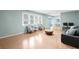 Light and airy living room with hardwood floors and large windows at 917 9Th Ave. S, North Myrtle Beach, SC 29582