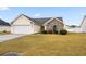 House exterior featuring a brick and vinyl facade and a driveway at 109 Governors Loop, Myrtle Beach, SC 29588