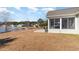 Backyard overlooking a community pond with a fountain at 1133 Spalding Ct., Surfside Beach, SC 29575