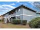 Two-story building exterior with stairs and landscaping at 1301 Pridgen Rd. # 1104, Myrtle Beach, SC 29577