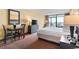 Bedroom with a king-size bed and small dining table at 1501 S Ocean Blvd. # 530, Myrtle Beach, SC 29577
