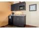 Small kitchenette with microwave, sink, and mini-fridge at 1501 S Ocean Blvd. # 530, Myrtle Beach, SC 29577