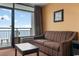 Living room with ocean view and comfortable sofa at 1501 S Ocean Blvd. # 530, Myrtle Beach, SC 29577