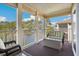 Balcony with lake view and wicker furniture at 1900 Duffy St. # H-9, North Myrtle Beach, SC 29582