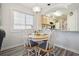 Small dining area with four chairs and a round table, adjacent to kitchen at 1900 Duffy St. # H-9, North Myrtle Beach, SC 29582