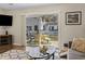 Living room with glass doors opening to a patio and backyard at 2040 Chadbury Ln., Myrtle Beach, SC 29588