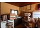 Wood-paneled kitchen with sink, cabinets, and packed boxes at 205 29Th Ave. N, North Myrtle Beach, SC 29582