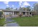 Brick house with a covered porch and grassy yard at 205 S Nichols St., Nichols, SC 29581