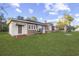 Brick home showcasing side view and yard at 205 S Nichols St., Nichols, SC 29581