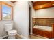 Bathroom with built-in bathtub and wood cabinets at 2103 Loblolly St., Georgetown, SC 29440