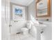 Bathroom with pedestal sink, toilet and white tile at 2103 Loblolly St., Georgetown, SC 29440