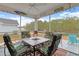 Screened porch overlooking the water with patio furniture at 225 Marsh Hawk Dr., Myrtle Beach, SC 29588