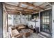 Covered patio with seating area, TV, and ceiling fan at 3 Meadow Oak Dr., Surfside Beach, SC 29575