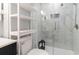 Clean bathroom with a toilet, shower, and shelving unit at 351 Lake Arrowhead Rd. # 12-245, Myrtle Beach, SC 29572